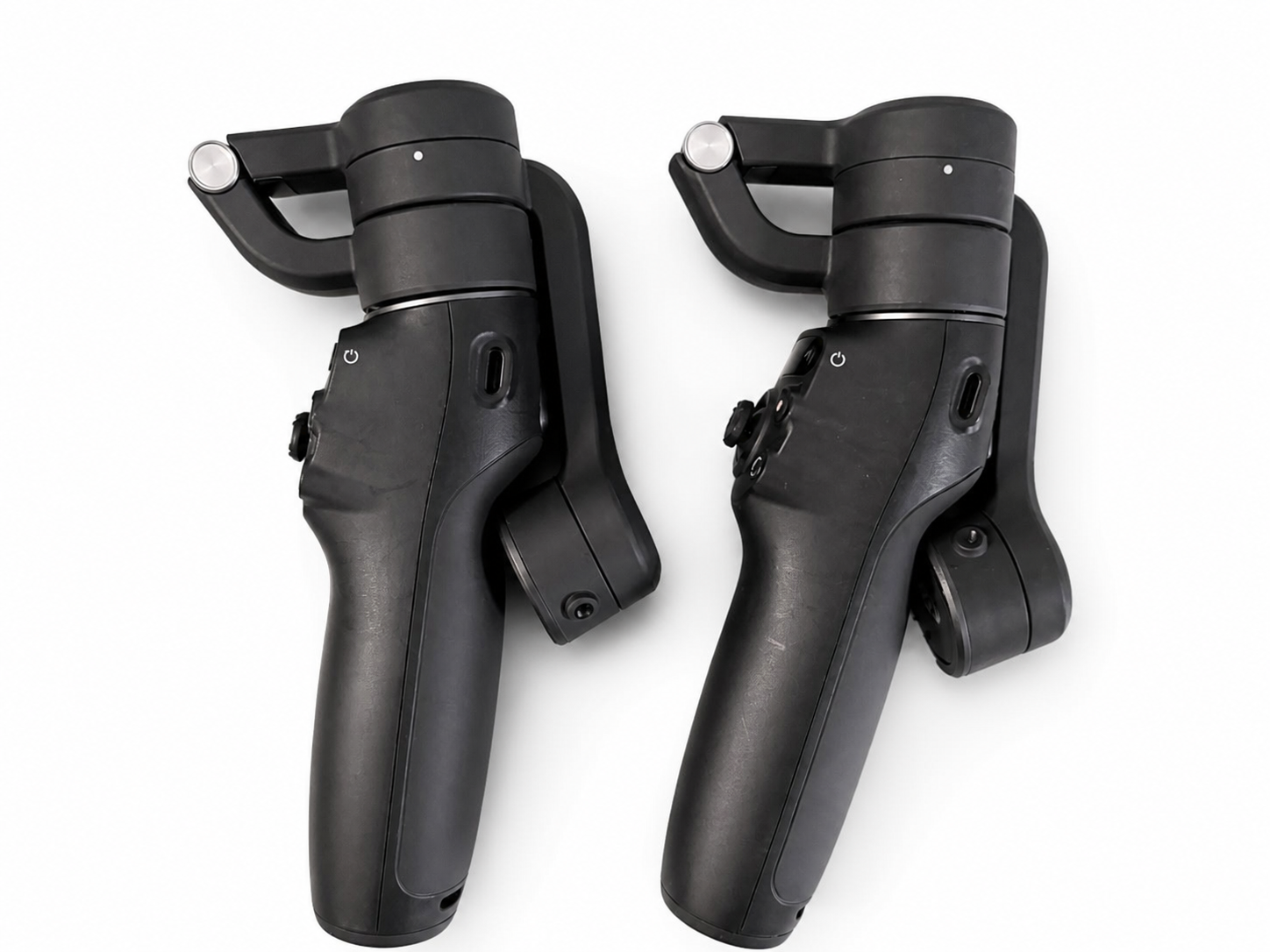Two black smartphone gimbal stabilizers